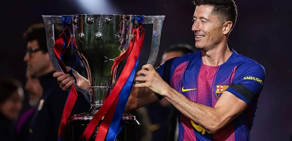 Player holding trophy after winning the match