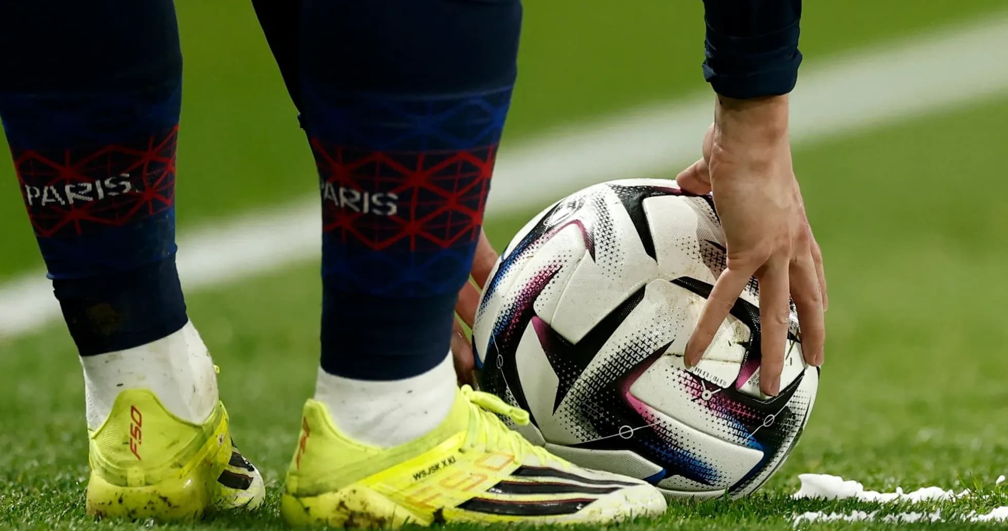 Player placing ball on the pitch for a kick