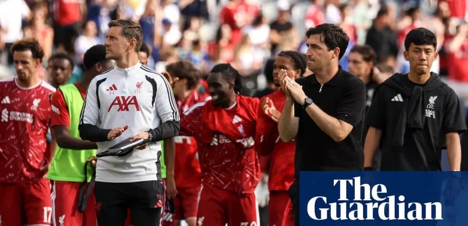 Liverpool team applauding fans after match