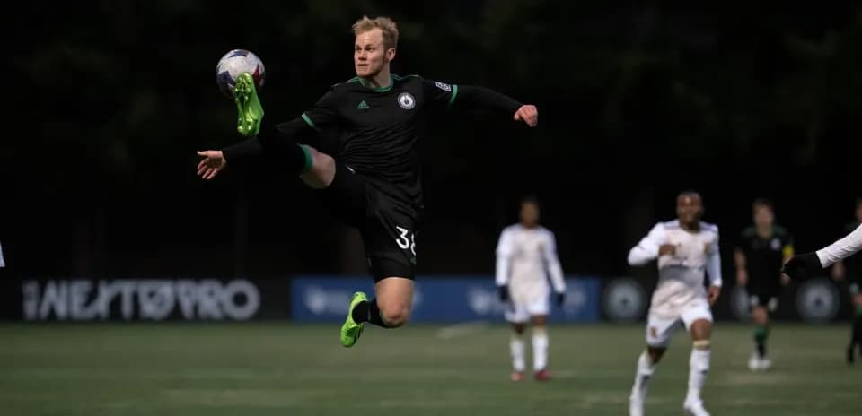 Goalkeeper kicking ball during Tacoma Defiance match