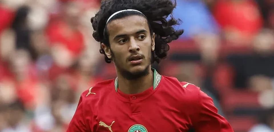 Player in red jersey running on the field