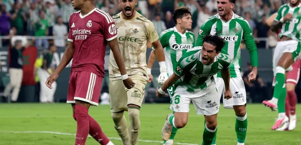 Real Betis players celebrate after scoring against Real Madrid