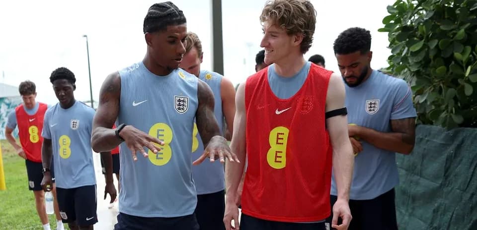 Players discussing during England training session