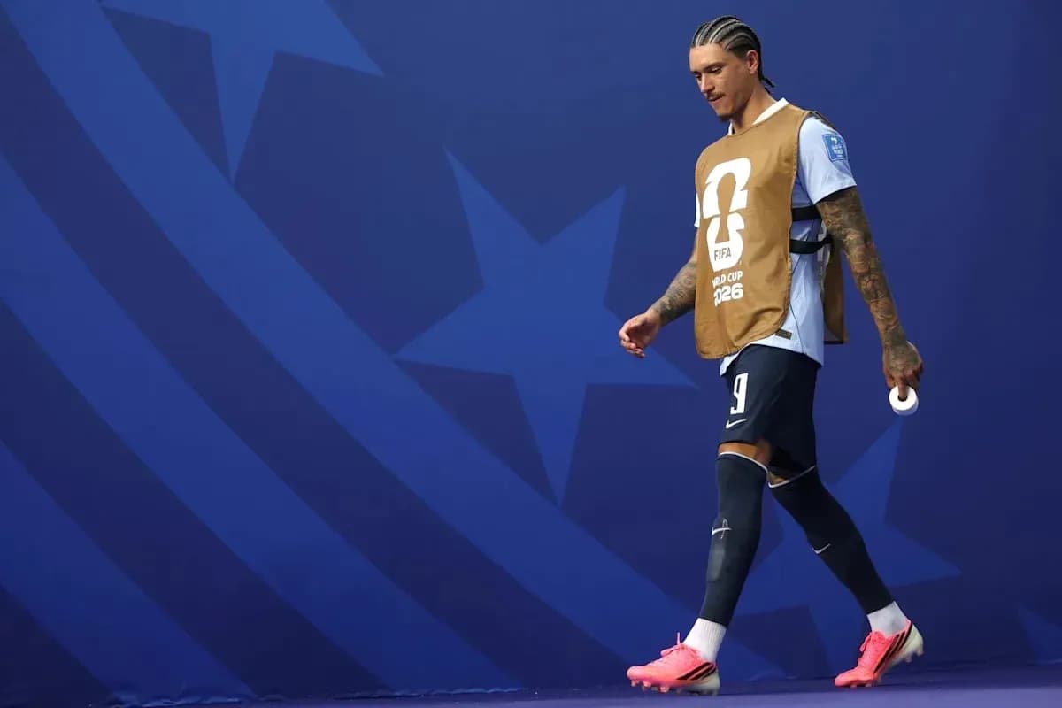 Player walking on the pitch in warm-up attire