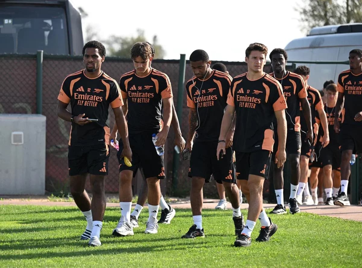 Arsenal players walking on training ground during session