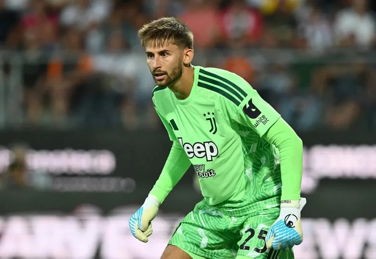 Goalkeeper in green jersey preparing for action
