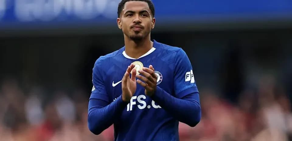 Player applauding fans in blue team jersey