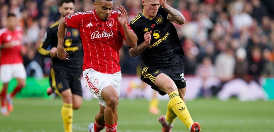 Nottingham Forest player sprinting with ball
