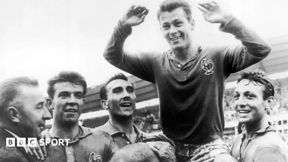 Players celebrating a victory, one being lifted up