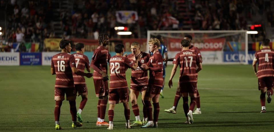 Players celebrating a goal during match