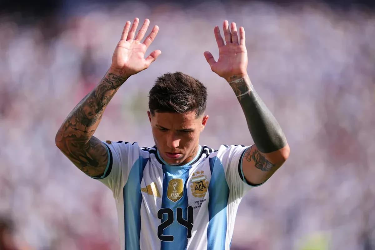 Player raising hands during a match in Argentina jersey