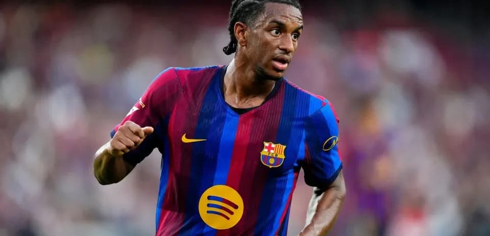 Player in FC Barcelona jersey running on the field