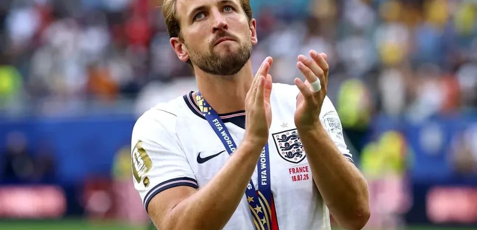 Player applauding while wearing bronze medal