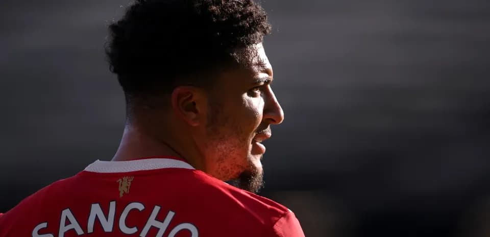 Player wearing red jersey with name 'SANCHO'