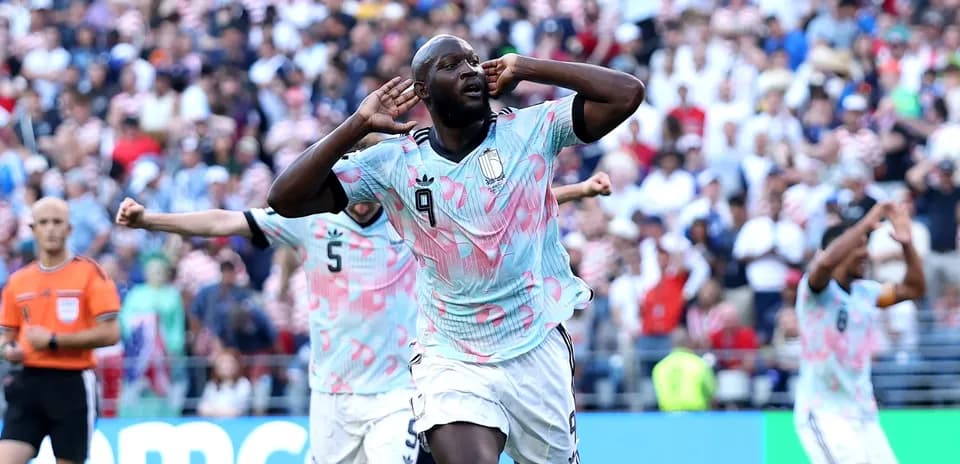 Player celebrating goal with crowd in background