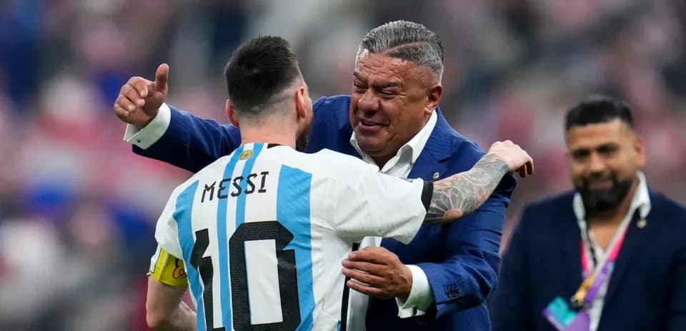 Lionel Messi embracing a team official after match