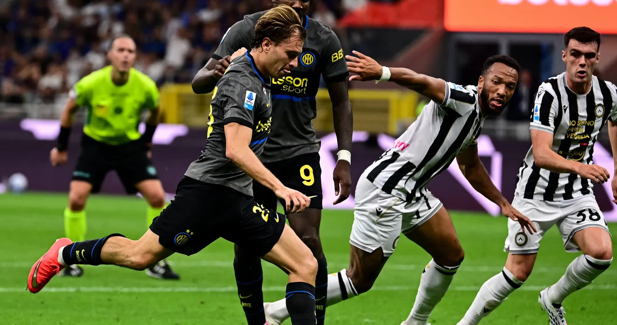 Player dribbling past opponents during match action