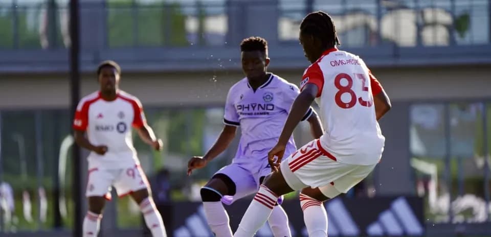 Connecticut FC and Toronto II players competing for ball