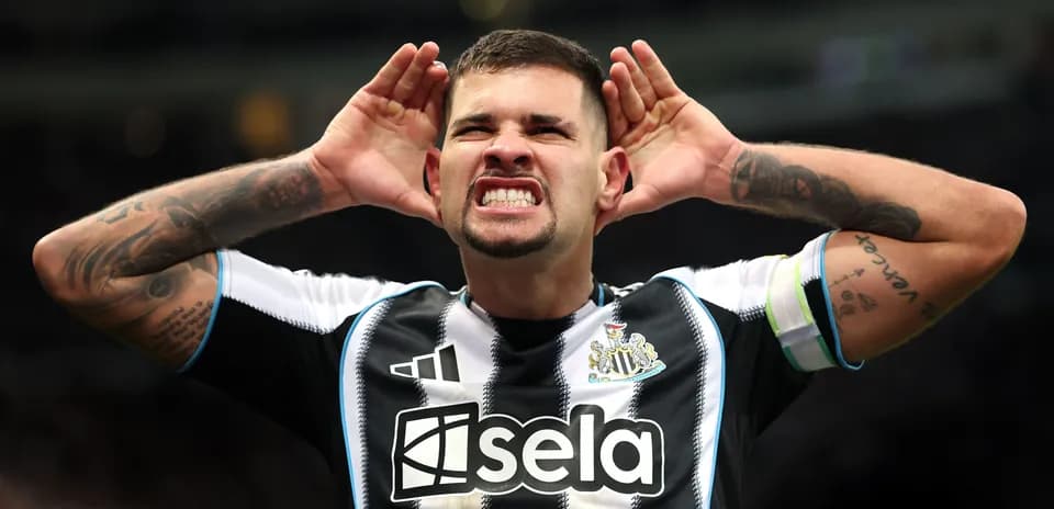Player celebrating with hands on ears at stadium