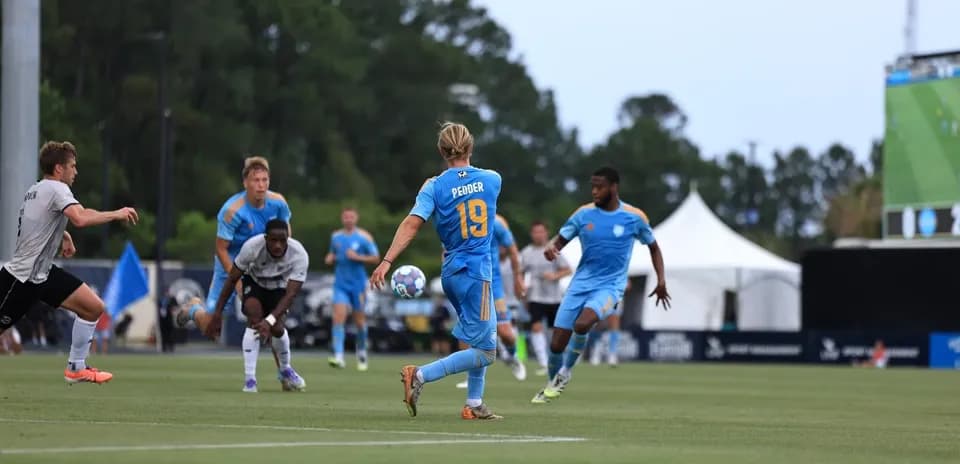 Player wearing number 19 passing the ball