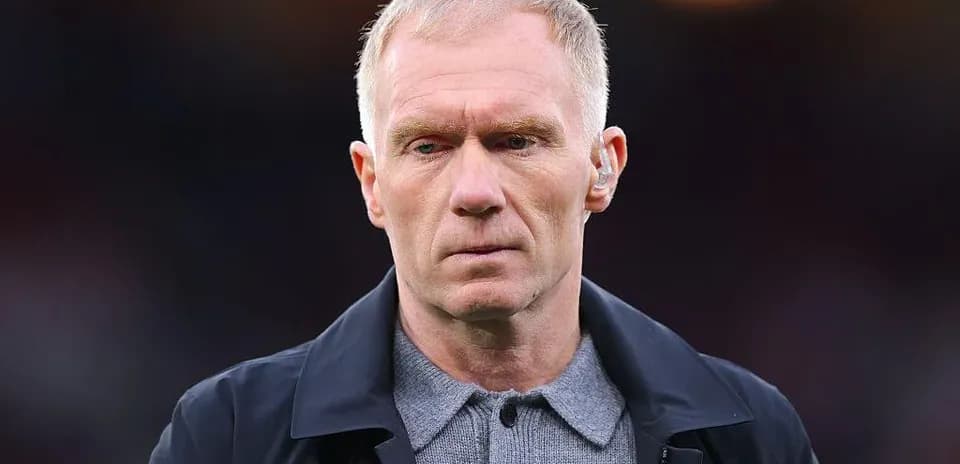 Man in a jacket with serious expression on face