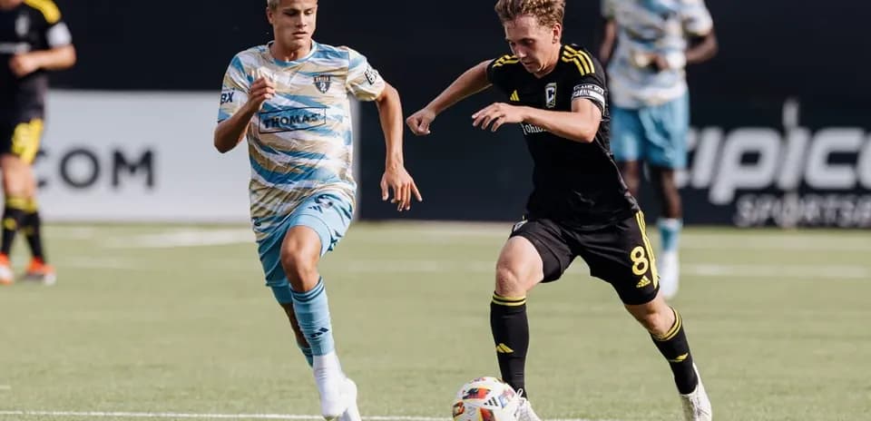 Players competing for the ball during MLS Next Pro