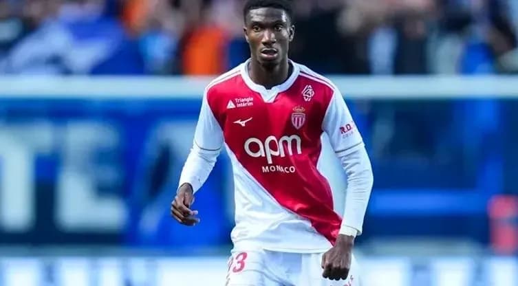 Player in AS Monaco kit during match action