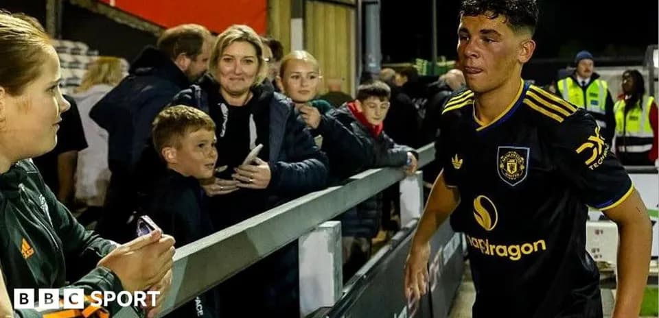 Young player walking past fans after match