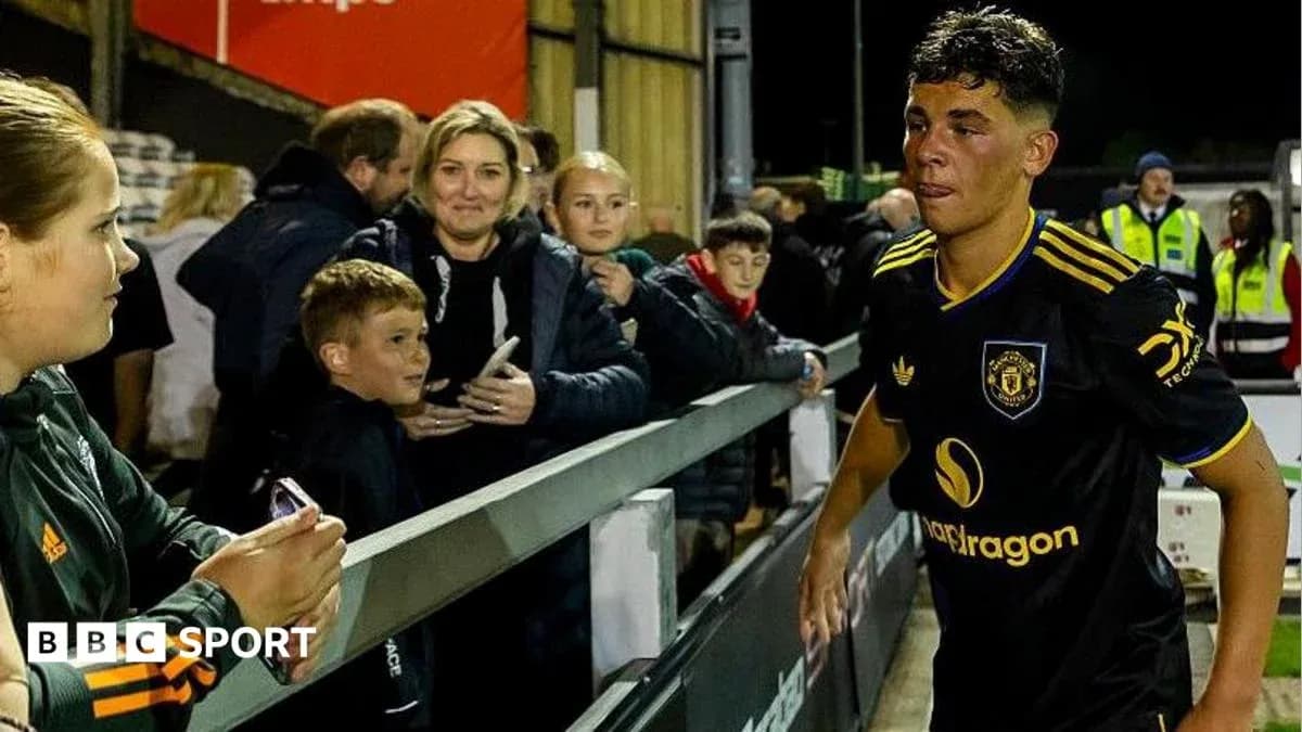 Young player walking past fans after match
