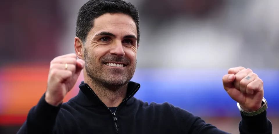 Coach celebrating with clenched fist during match