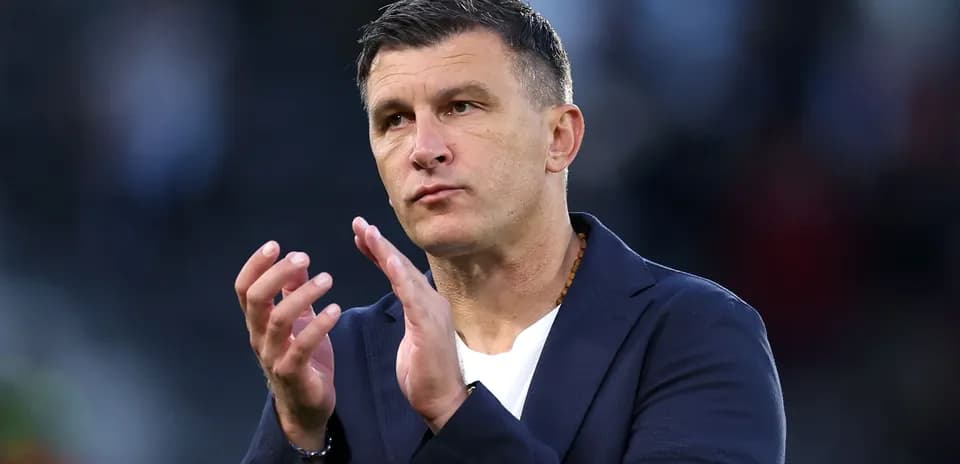 Coach applauding during a match or event