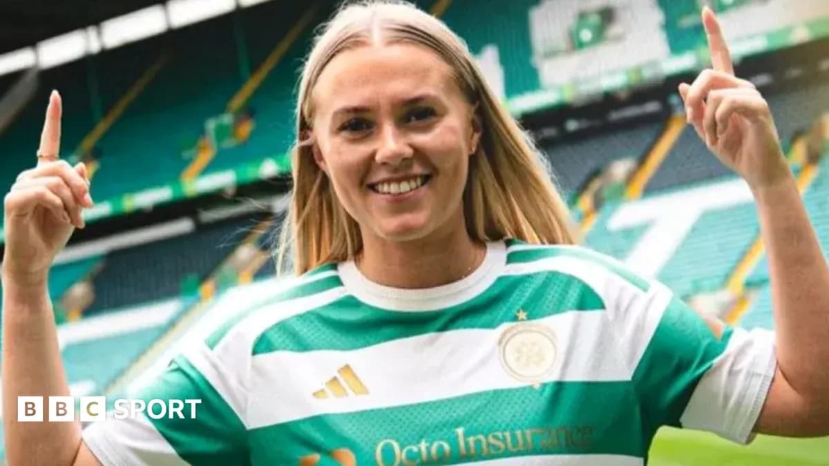 Player celebrating in Celtic jersey at stadium