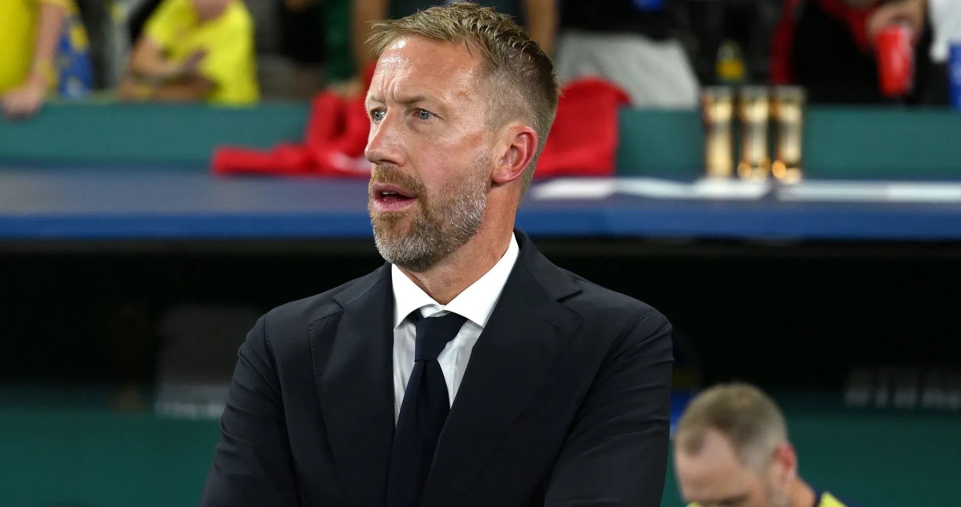 Coach observing the match from the sideline
