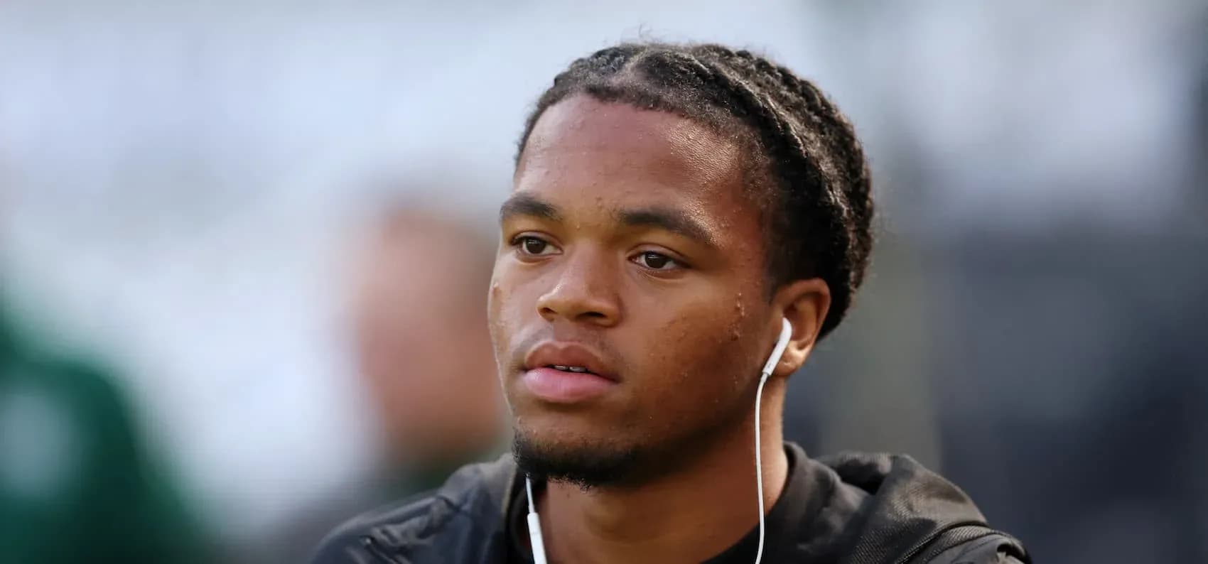 Player wearing earphones before the match