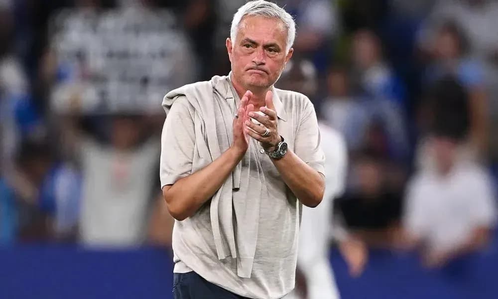 Manager applauding fans after match conclusion