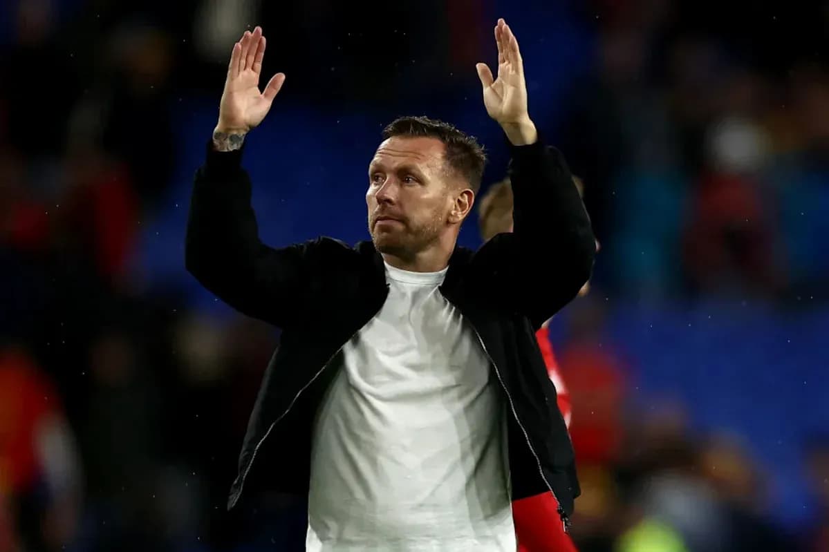 Man raising hands to crowd after match
