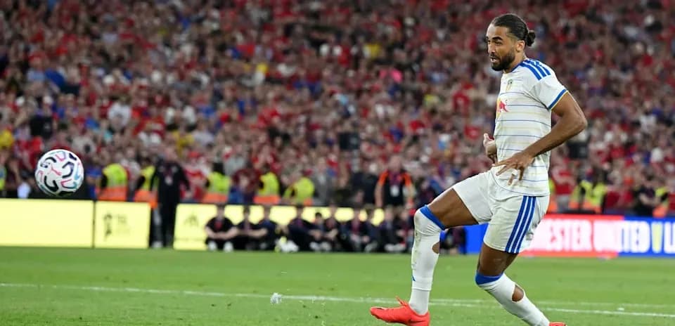 Player kicking ball during intense match moment