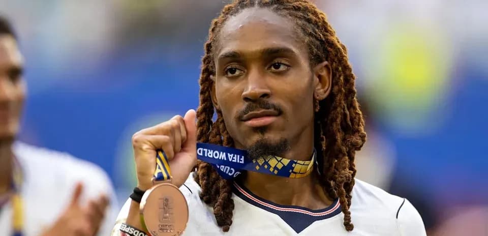 Player holding bronze medal after tournament