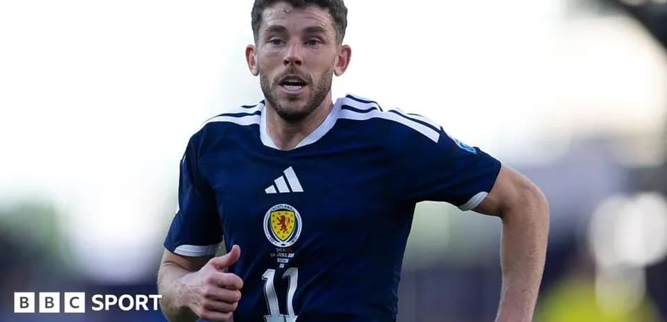 Scottish player running on the pitch during match