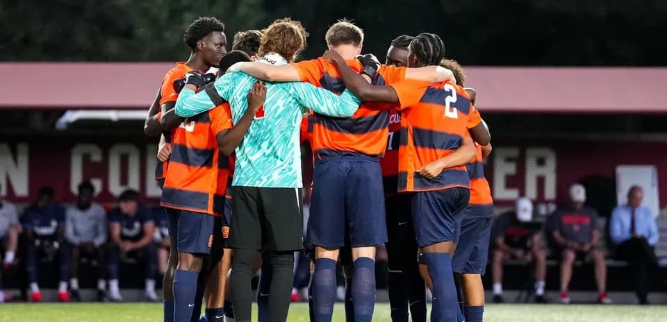 Soccer team huddling before the match