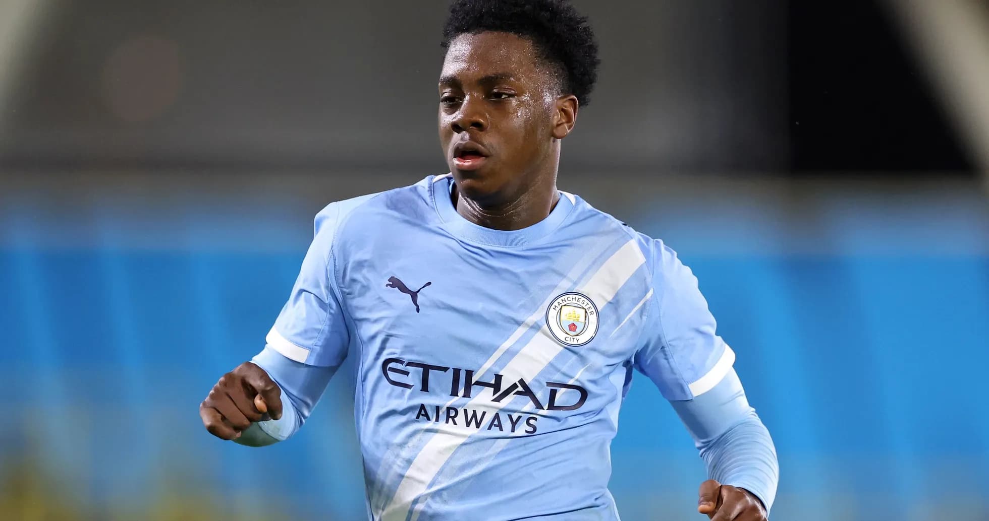 Player in Manchester City kit during match action