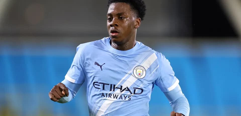 Player in Manchester City kit during match action