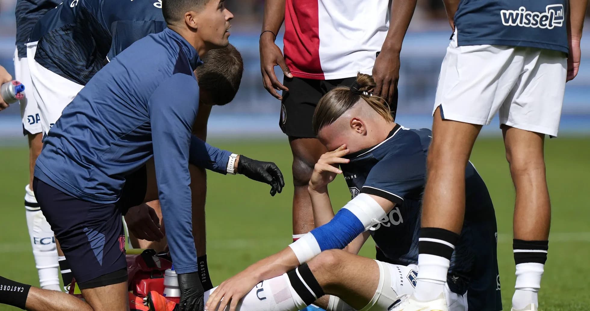 Player receiving medical attention on the field
