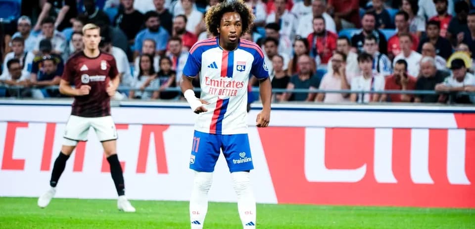 Player in Olympique Lyonnais kit on the field