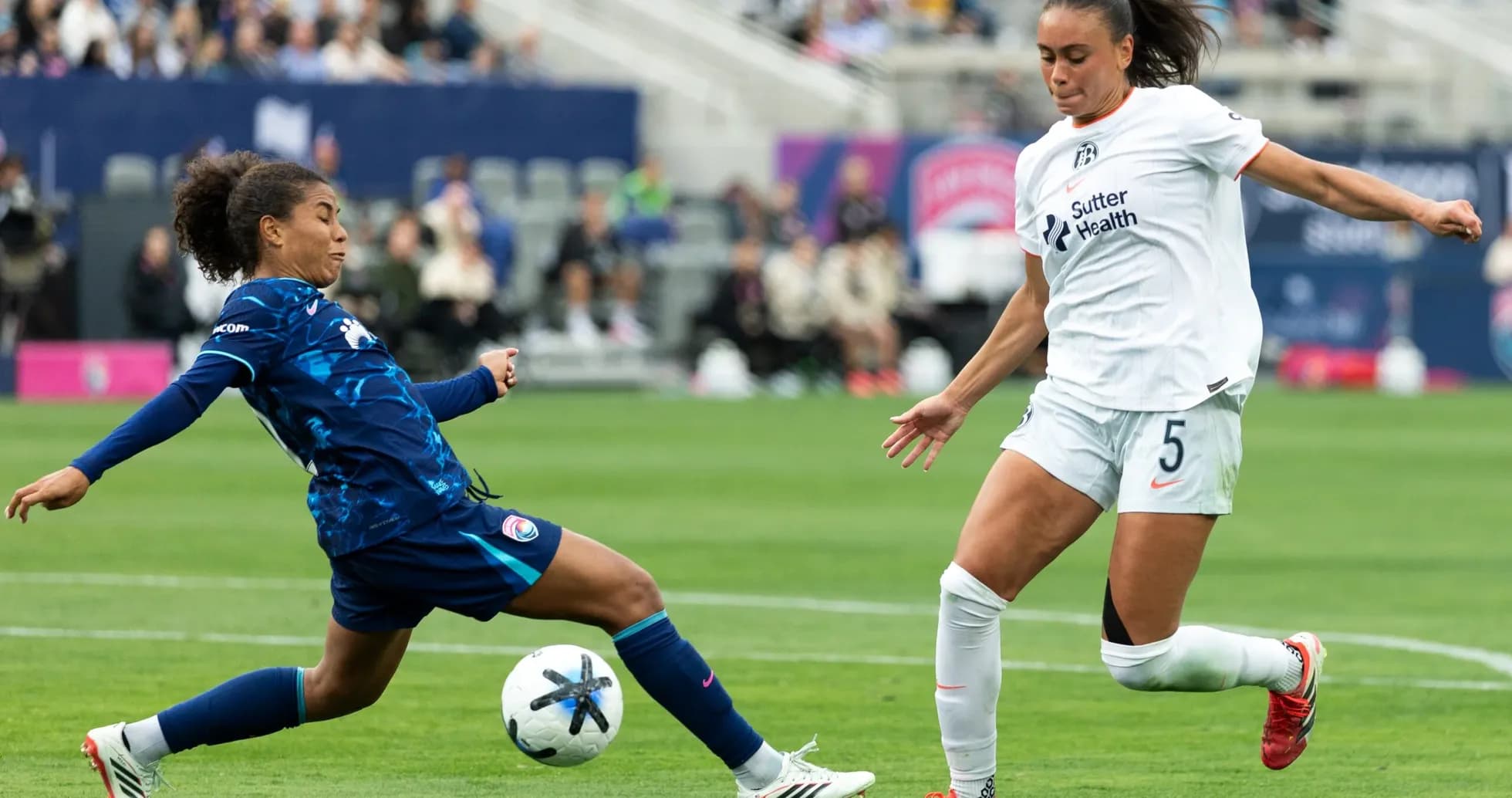 Two players competing for the ball during match