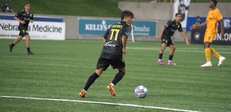 Player dribbling the ball in USL match
