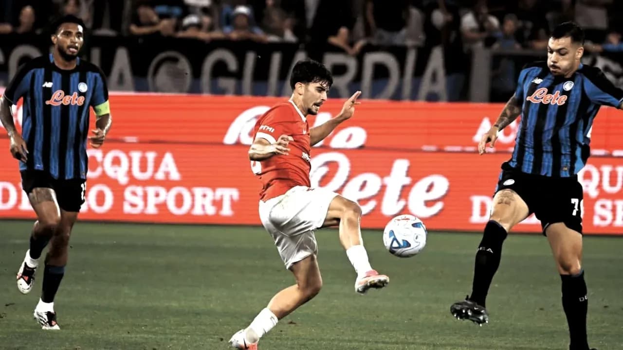 Player kicking ball during match between teams