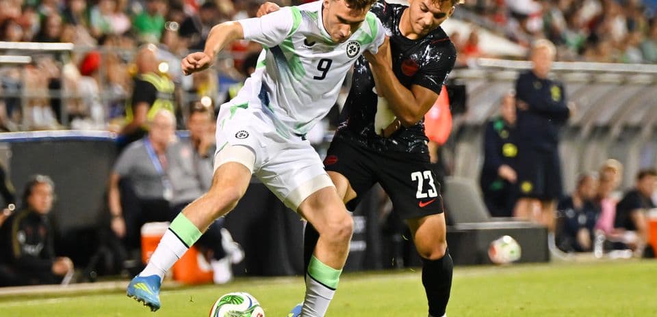Two players battling for the ball during match