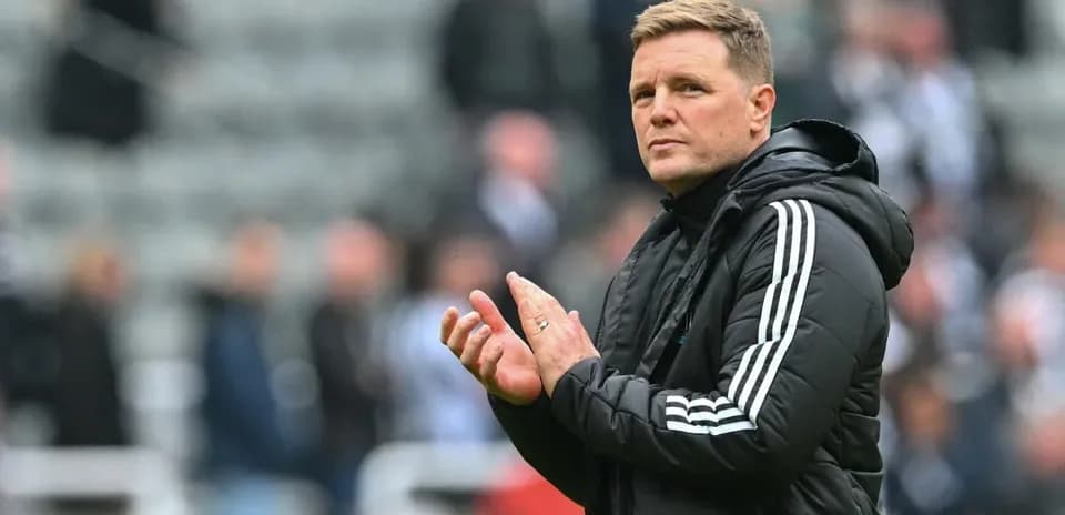 Coach applauding fans during match at stadium