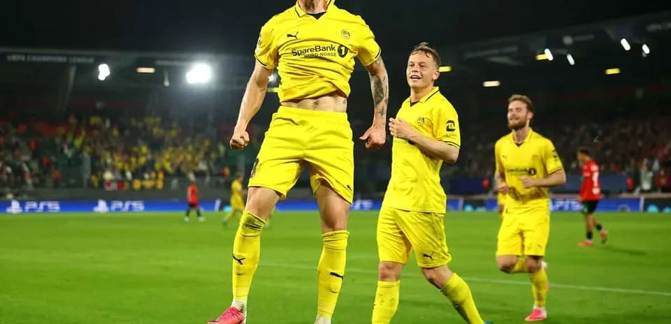 Players celebrating a goal during UEFA Champions League match